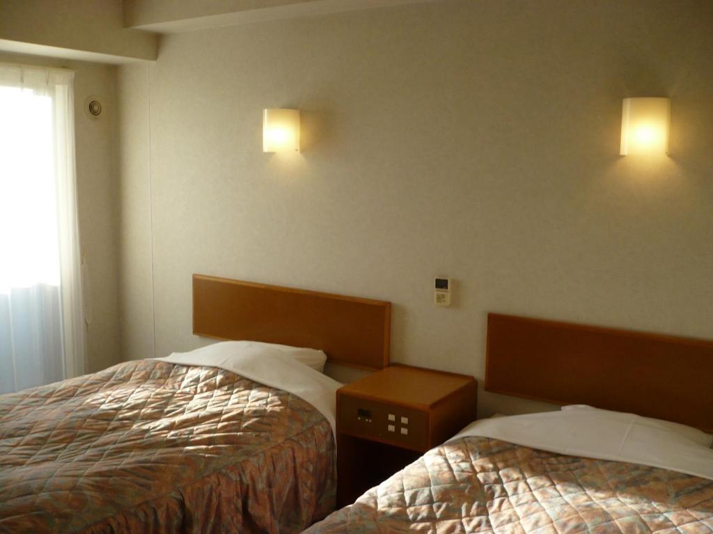 Hotel New Budget Muroran Cameră foto